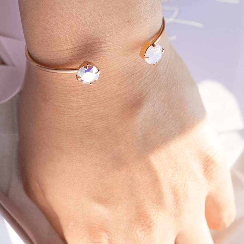   Apzeltīta rokassprādze Swarovski ar zaļgani dzeltenu un rozgani violetu kristālu